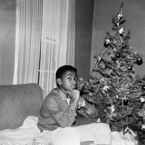 John Ware by a Christmas tree, 1834 Eighteenth Street, Santa Monica, December, 1958