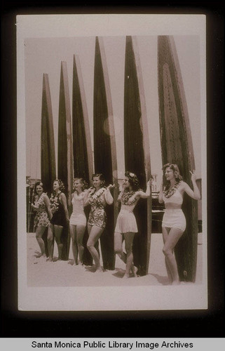 Women with paddle boards at the Santa Monica Pier