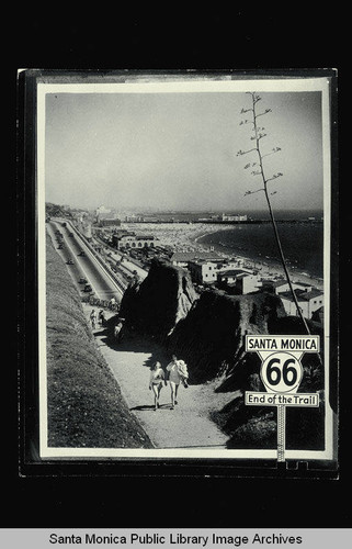 Santa Monica Bay and Pier from the Palisades with a sign marking the end of former US Route 66