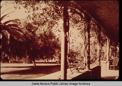 Miramar front porch with cane chair and wisteria, Santa Monica, Calif