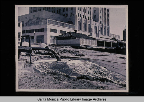 Santa Monica tide studies with discharge pipe for the dredge near the Grand Hotel with tide 2.6 feet at 11:05 AM on February 9, 1939