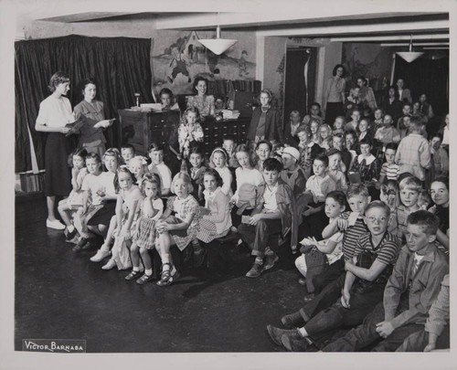 Library staff and children in the Boys and Girls Room
