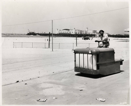 Beach cleaning with a D-2 tractor in Santa Monica, Calif