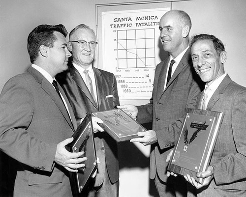 Photographer and Chairman of Santa Monica Chamber of Commerce Victor Barnaba (far right) and others at a Safety Committee award ceremony, Santa Monica, Calif