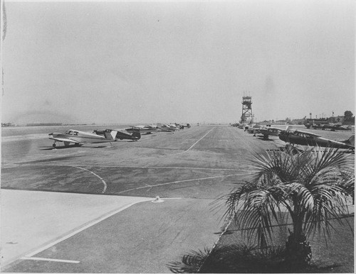 Airplanes on the tarmac near the Santa Monica Municipal Airport Control Tower