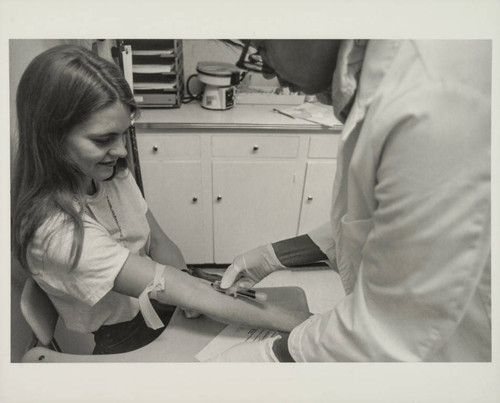 Woman receiving a shot at Westside Women's Health Center, Santa Monica, Calif