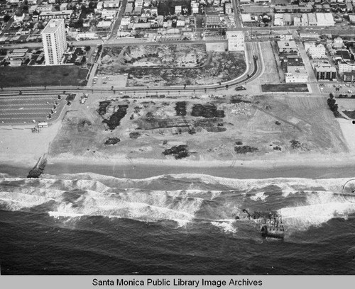 Looking east from the remains of the Pacific Ocean Park Pier toward Ocean Park and the Santa Monica Shores Apartments high-rise, April 17, 1975, 11:50 AM