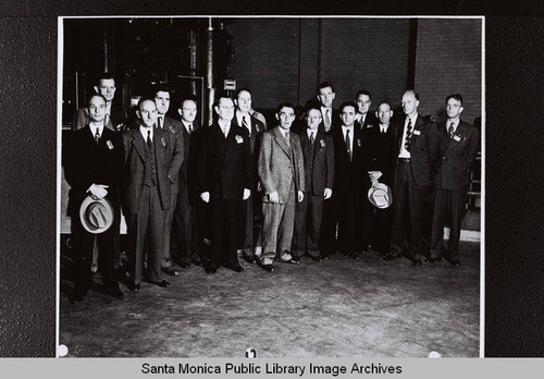 Men wearing construction badges at the Douglas Aircraft Company Santa Monica plant during World War II