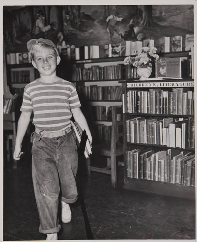 Boy with an armful of books