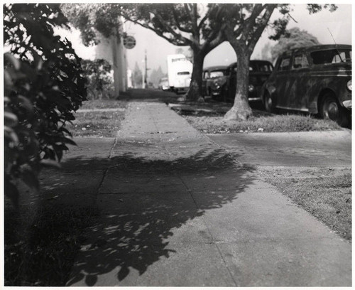 Sunken sidewalk in front of the Studebaker Agency at 1220 Sixteenth Street in Santa Monica, January 27, 1953