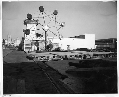 View of abandoned Ocean Park Pier including the Midway, Dome Theater, Hi-Boy Rollercoaster, Skooter Bumper Cars, and Rock-O-Plane ride in the foreground, Santa Monica, Calif