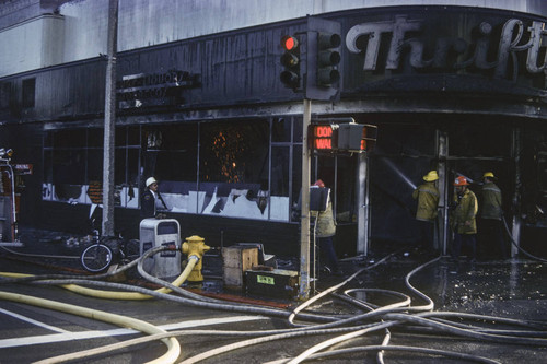 Firefighters battling a blaze at Thrifty Drug Store at 326 Wilshire Blvd