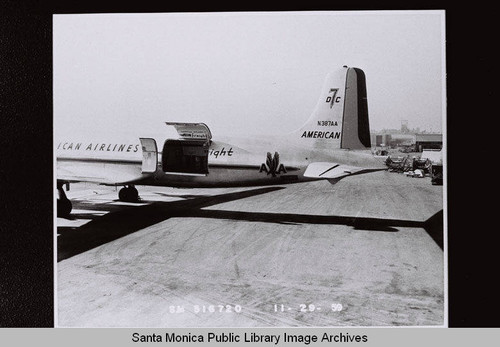 American Airlines Douglas Aircraft Company DC-7 with cargo door open at the Santa Monica Municipal Airport, November 29, 1959