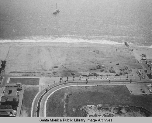 View of the remains of the Pacific Ocean Park Pier looking west to a barge in Santa Monica Bay, August 13, 1975, 2:30 PM