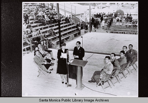 Lola Lane at the microphone for a program in the Douglas Punch Bowl, December, 1943