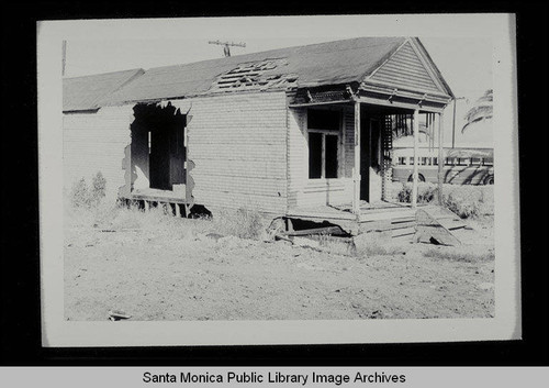 Burning a derelict house on Belmar Place between Main and Third Streets, north of Pico, on July 1, 1953