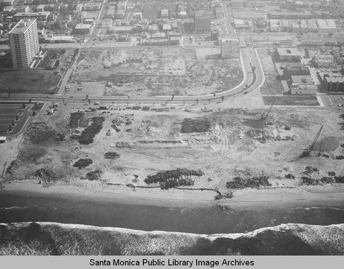 Looking east from the remains of the Pacific Ocean Park Pier toward Ocean Park and the Santa Monica Shores Apartments high-rise, April 3,1975, 11:00 AM