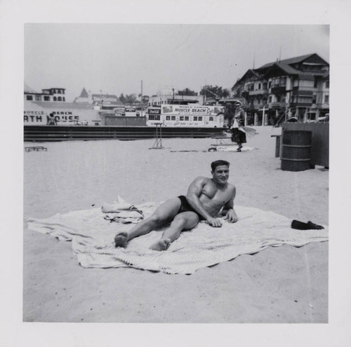 Man relaxing on Muscle Beach, Santa Monica, Calif