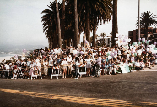 Crowd gathered to watch the Olympic torch relay on July 21, 1984, Santa Monica, Calif