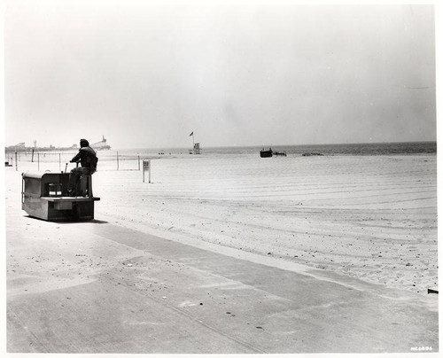 Beach cleaning with a D-2 tractor in Santa Monica, Calif