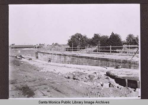 The arroyo south of Colorado Avenue looking east to the Patten & Davies Lumber Company at Fourth Street and Colorado Avenue, Santa Monica, Calif