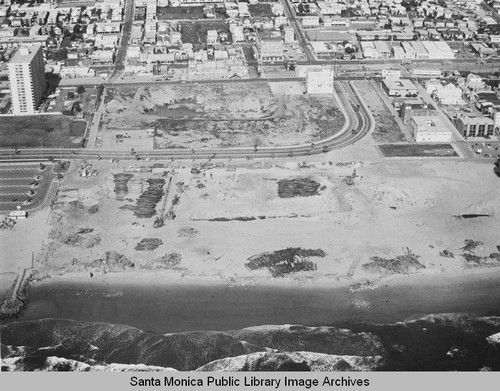 Looking east from the remains of the Pacific Ocean Park Pier toward Ocean Park and the Santa Monica Shores Apartments high-rise, March 27, 1975, 2:00PM