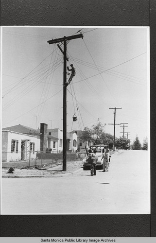 Repairing a telephone pole, Santa Monica, Calif