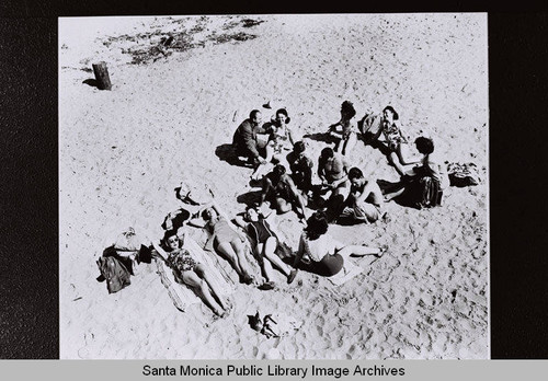 Douglas Aircraft Company employees are photographed enjoying recreation time "Life at the Beach" during World War II