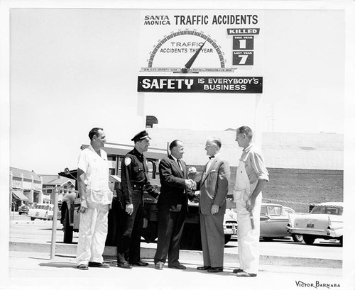 City officials at an event sponsored by Santa Monica Chamber of Commerce Safety Committee with a ''Safety is everybody's business'' sign in the background, Santa Monica, Calif