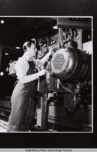 Douglas Aircraft Company employee, Harry Schooler at the Santa Monica plant during World War II