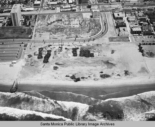 Looking east from the remains of the Pacific Ocean Park Pier toward Ocean Park and the Santa Monica Shores Apartments high-rise, May 1, 1975, 1:10 PM