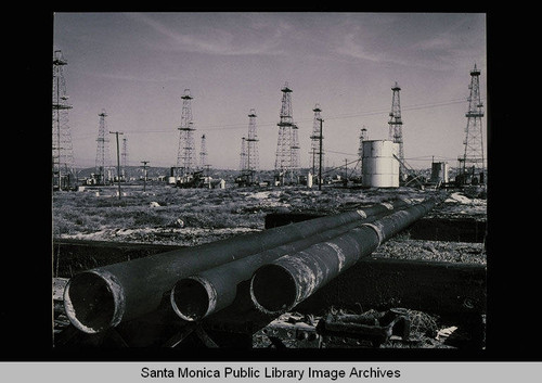 Oil wells looking southeast to Marina Del Rey, Calif