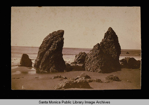 Beach scene with large rocks, Santa Monica, Calif