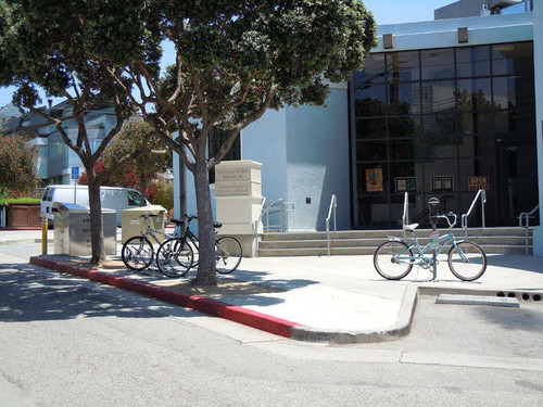 Bicycles and the Ocean Park Branch Library four-sided pedestal signage by the Norman Place entrance, installed April 18, 2011