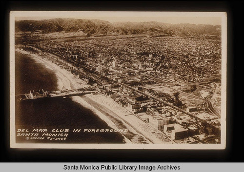 Aerial view of the coast,Santa Monica Pier, and Del Mar Club looking north to the Santa Monica Mountains