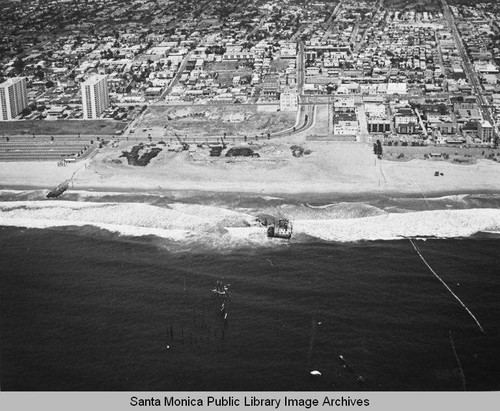 Looking east from the remains of the Pacific Ocean Park Pier toward Ocean Park and the Santa Monica Shores Apartments high-rise, May 20, 1975, 1:30 PM