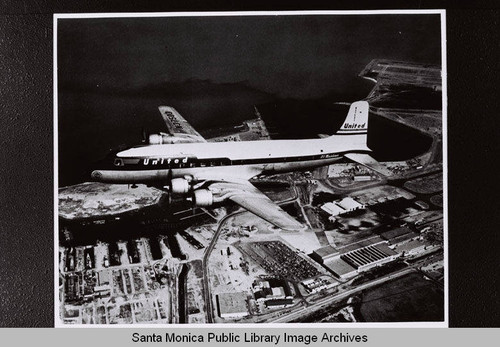 United Airlines Douglas Aircraft Company DC-6 in flight above the coastline on January 10, 1980