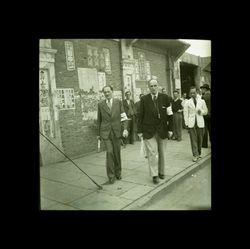 Men with armbands outside of a building, Shanghai, China