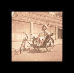 Chinese woman on a tricycle carriage, Shanghai, China