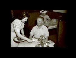 Waitress serving coffee to a man, Shanghai, China