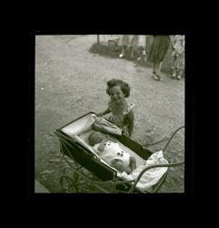 Girl and an infant in baby carriage, Shanghai, China