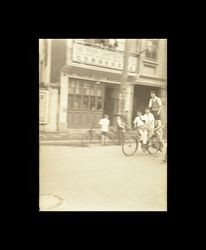 Boys riding a bicycle, Shanghai, China