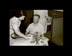 Waitress serving coffee to a man, Shanghai, China