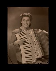 Portrait of Inga Michelson playing a Hohner accordion, Shanghai, China