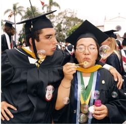 Students blowing bubbles at Loyola Marymount University commencement, 1997