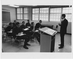 Ernest Martinez, S.J., and students in class