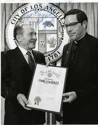 Donald Merrifield, S.J. receiving award from Mayor Sam Yorty