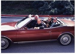 Thomas P. O'Malley, S.J., with Father John Rogers, Mr. and Mrs. Hernando Cartwright