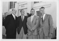 Pete Newell, Oliver Polich, and Phil Woolpert in front of St. Robert's Hall