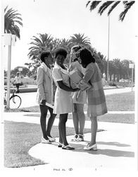 Four female students on Alumni Mall